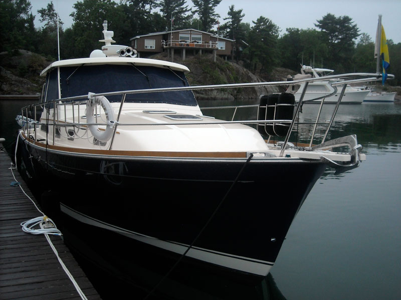 Photo: Downeast yacht atROQUES MARINA at Killarney, Ontario, on foggy morning