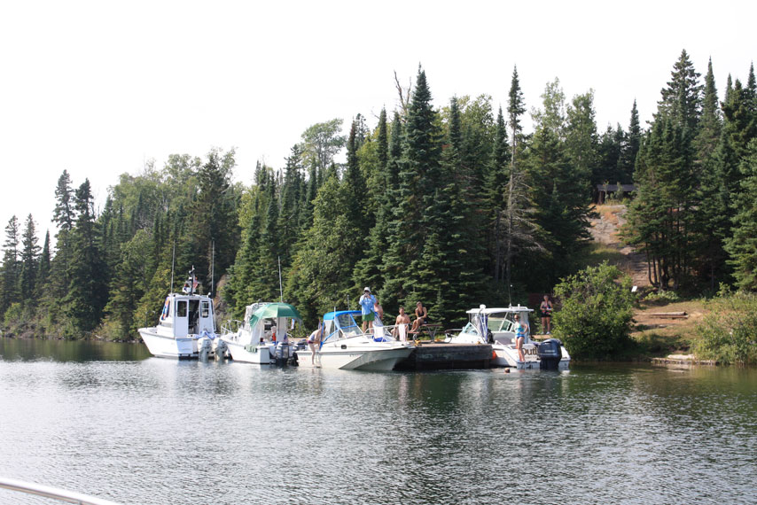 Photo: Four boats at dock at Chippewa Harbor, Isle Royale, seen from seaward