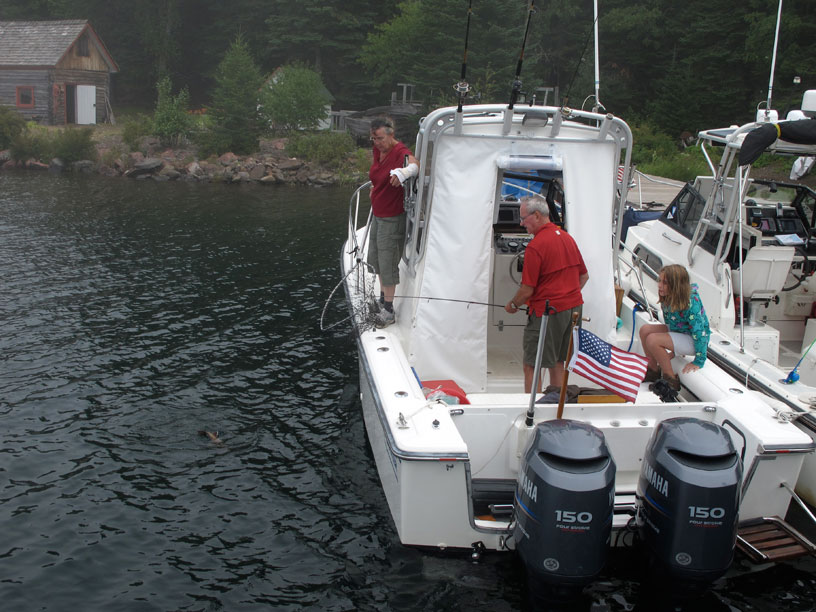 Photo: David Hart landing fish from aft deck.