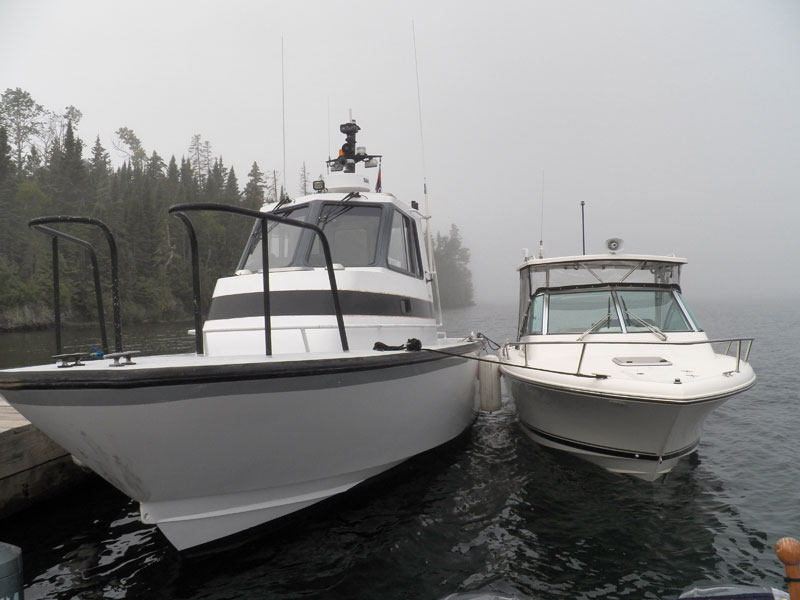 Photo: Side-by-side size comparison of two boats.