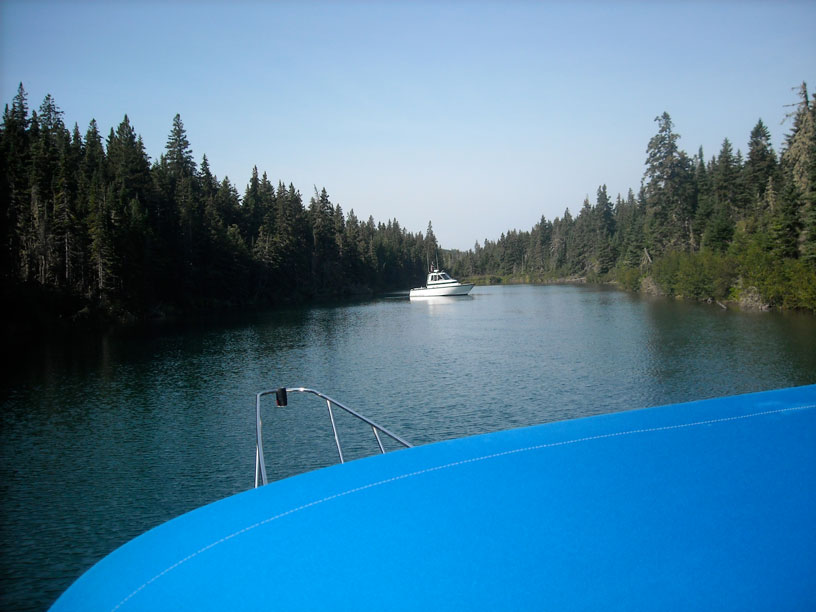 Photo: Boat manuevering in narrow cove.