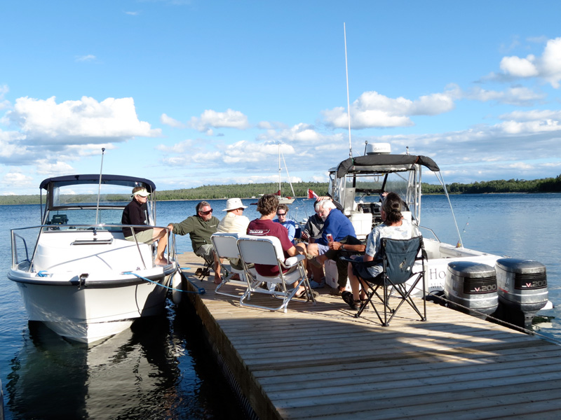 Photo: Boat crews on dock at Meldrum Bay, Manitoulin Island, Ontario.