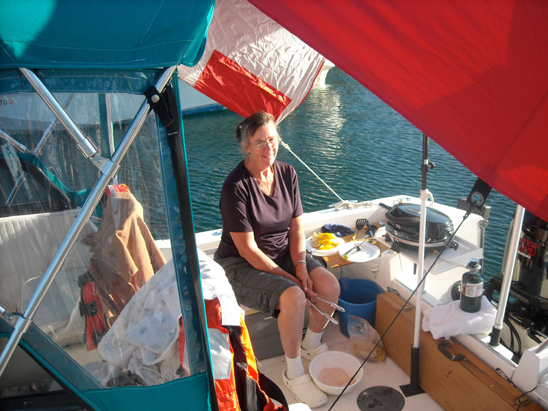 Photo: Kathy Hart cooks in the cockpit of WALKABOUT