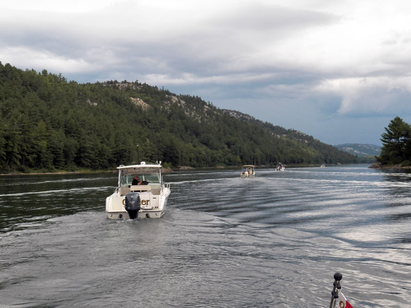 Photo: Four boats heading for The Pool under cloudy skies