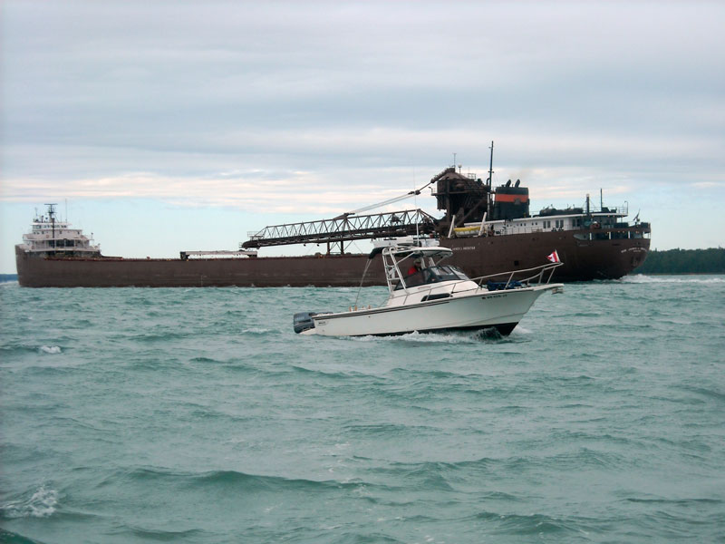 Photo: HOLLY MARIE meets freighter on the St. Marys River.