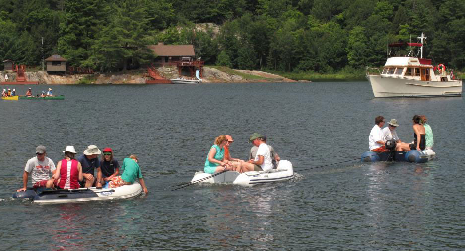Photo: Three dinghies loaded with passengers