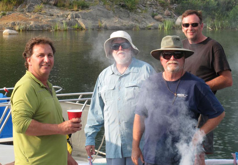 Photo: Men at the grill preparing dinner
