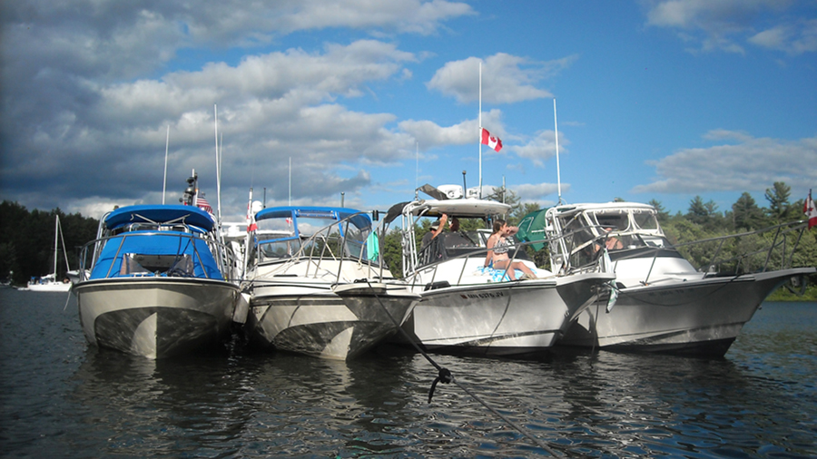 Four boats rafted at The Pool