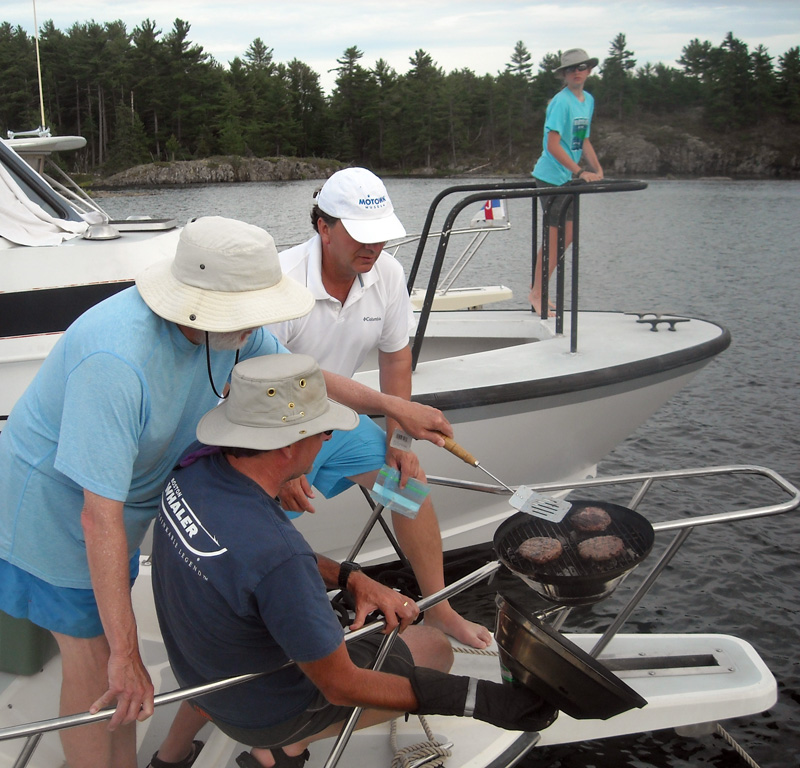Cooking on grill on foredeck railing