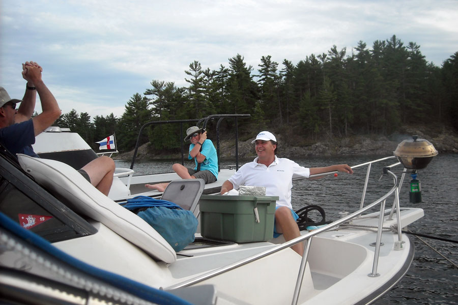 Men relax on foredeck