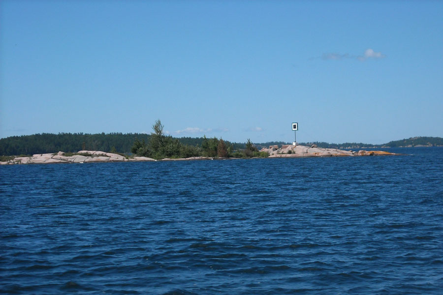 Island with daymark in Whalesback Channel