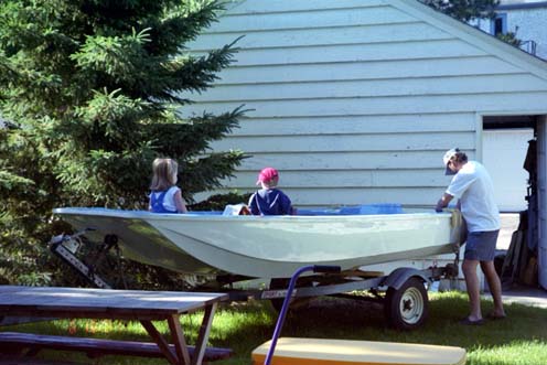Photo: 1959 Boston Whaler 13-Sport with owner/restorer Mike Gephart and children