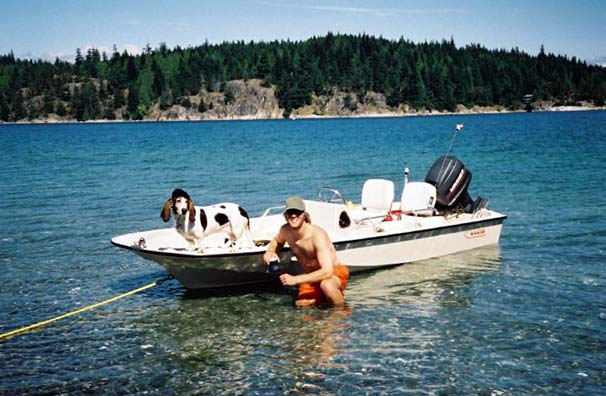 Photo: 1989 15-GLS moored to shore, with owner Andrew Sherlock and mascot Lowla
