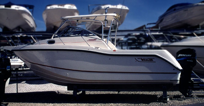 Photo: 2002 255 Conquest Profile view on display ashore