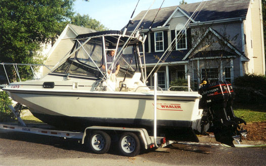 Photo: 1986 Boston Whaler 22-Revenge WT on trailer with canvas and outriggers 