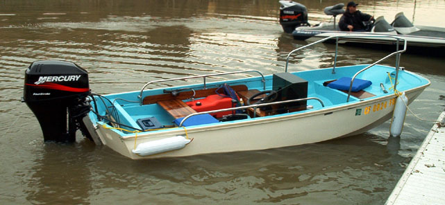 Photo: 1962 13-Sport in water showing static trim with modern 4-stroke engine
