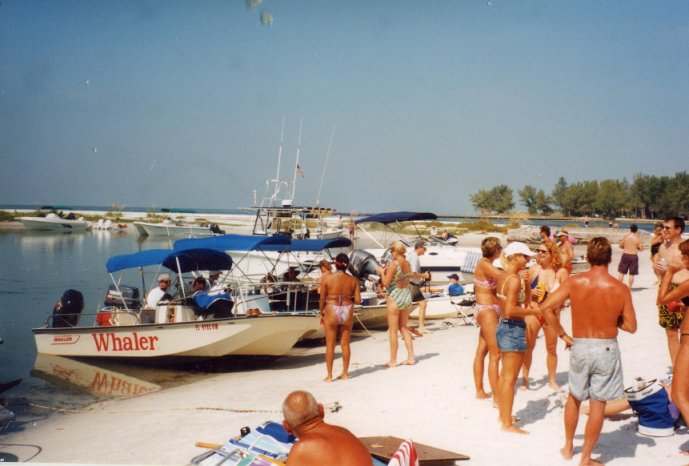 Photo: Unidentified people on Beer Can Beach admiring Whaler Montauk and others