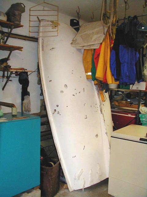 Photo: Boston Whaler Squall sailboat stored vertically to promote drainage of water