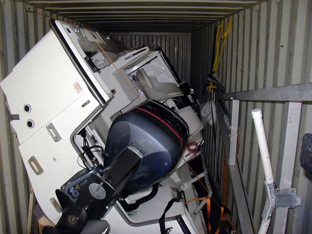 Photo: Walkaround 21 tilted onto starboard beam and placed in shipping container