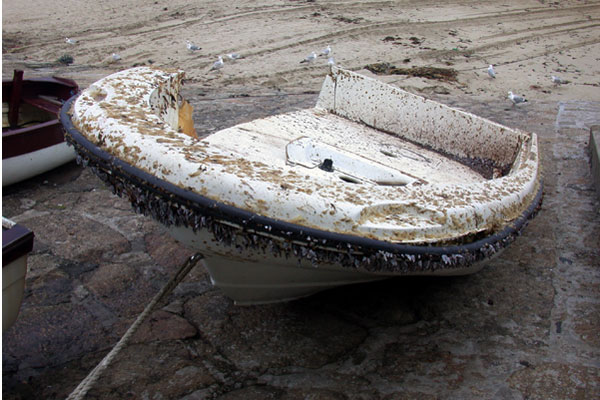 Photo: Derelict Boston Whaler on beach in Great Britain
