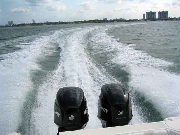 Photo: Boston Whaler 240 OUTRAGE with twin VERADO 150-HP engines; wake view