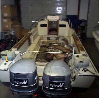 [Photo: 1983 Whaler 25 Outrage Cuddy Stripped interior]