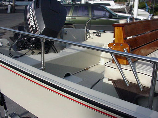[Photo: Boston Whaler Montauk interior with molded cover in stern]