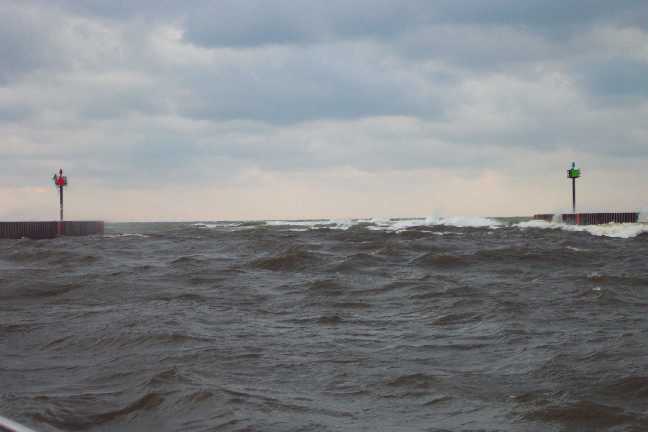 [Photo: Lake Michigan, 8 foot breaking wave in entrance channel, Holland]