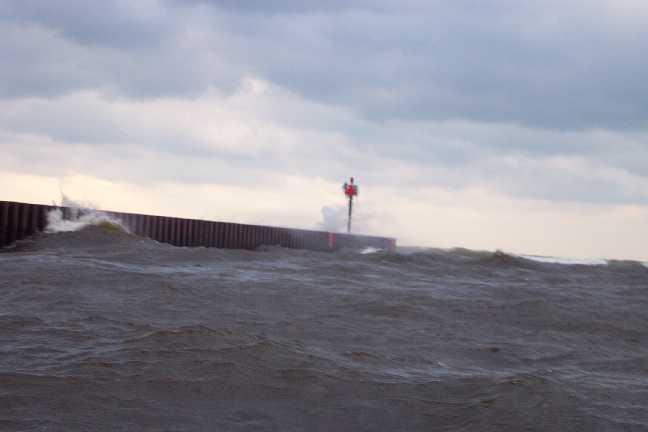 [Photo: Lake Michigan waves crashing on breakwall]