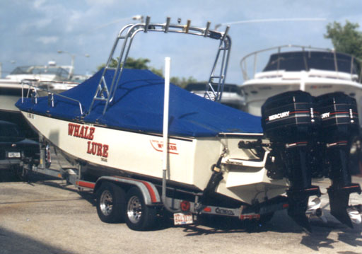 [Photo: 1989 Whaler 25 Outrage On trailer with mooring cover]