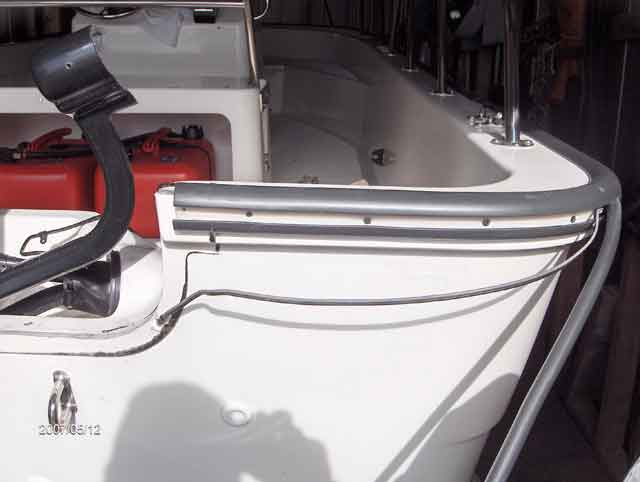 Photo: Stern view of Boston Whaler 170 MONTAUK hull showing transom with rub partially removed.