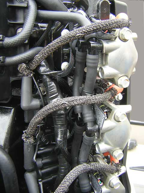 [Photo: Evinrude 225-HP E-TEC Outboard close-up of fuel rails.]