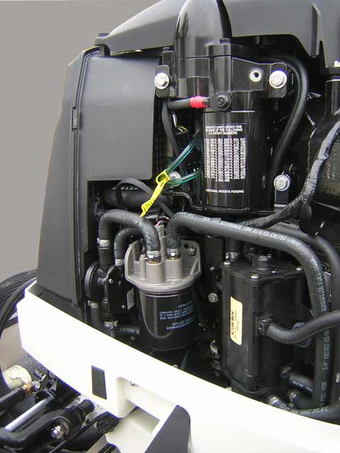 [Photo: Evinrude 225-HP E-TEC Outboard close-up port forward side of engine.]