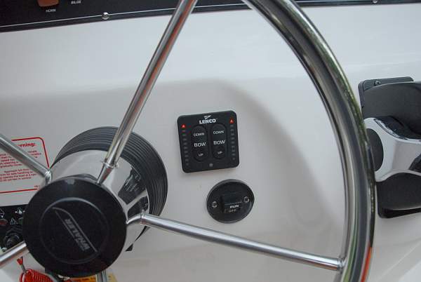 Photo: Trim tab controls installation on helm console of Boston Whaler 190 NANTUCKET.