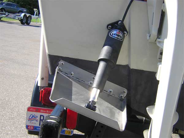Photo: Trib tab installation on Boston Whaler OUTRAGE 20 showing tabs mounted on non-raised portion of transom
