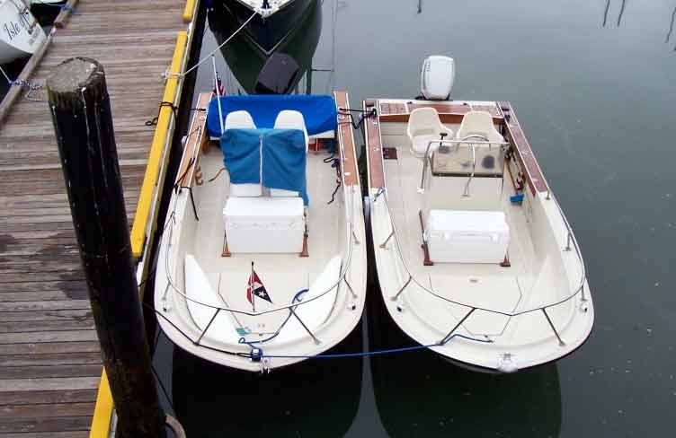 Photo: Two OUTRAGE 18 transoms, side by side, showing comparative waterline. One with full transom, one with notched transom.