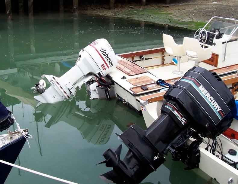 Photo: Two OUTRAGE 18 transoms, side by side, showing comparative waterline. One with full transom, one with notched transom.