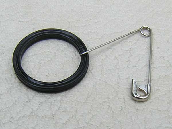 [Photo: Close-up of removed seal]