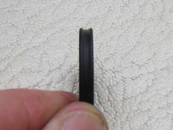[Photo: Close-up of removed seal]